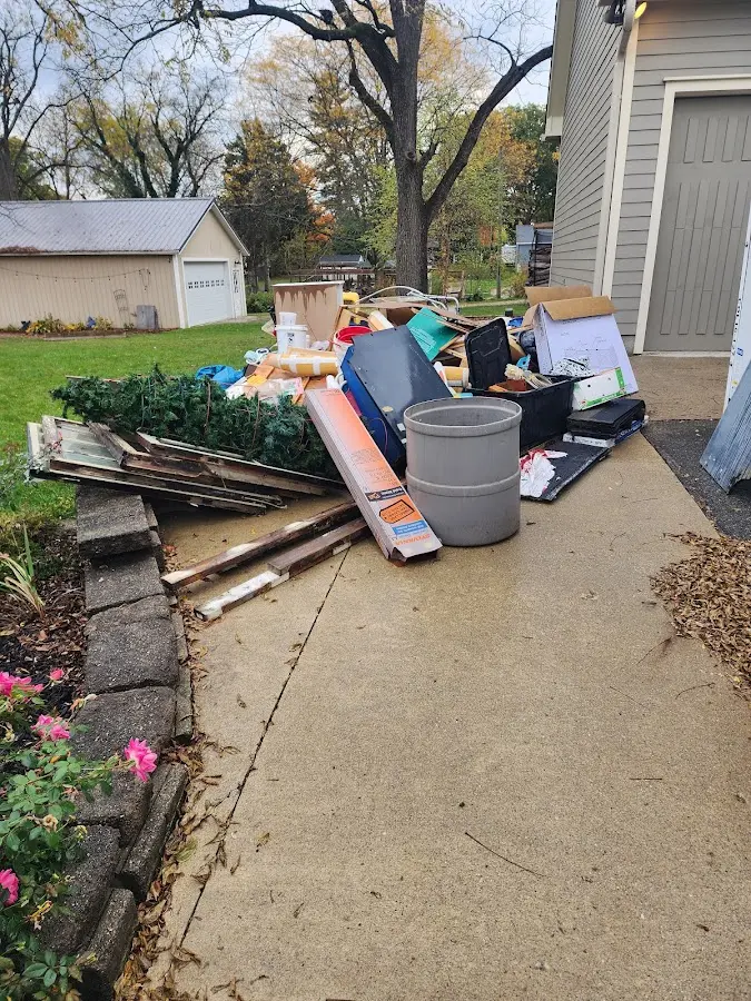Dumpster being loaded with debris for 3 Yard Dumpster Rental in South Laurel